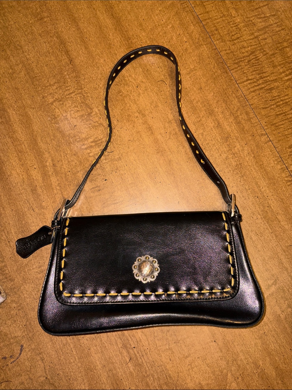 Classic Black Leather Crossbody with Decorative Concho